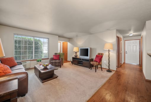 a living room with a couch and a tv