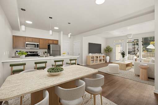 A modern kitchen with a dining table and chairs.