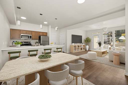 A modern kitchen with a dining table and chairs.