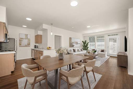 A modern dining room with a large table and chairs.