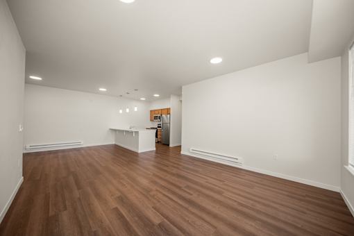 A room with wooden floors and white walls.