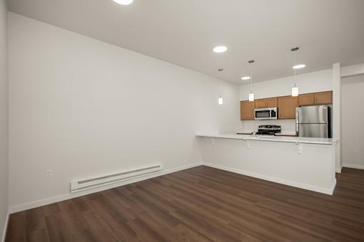A kitchen area with a microwave and oven on the counter.