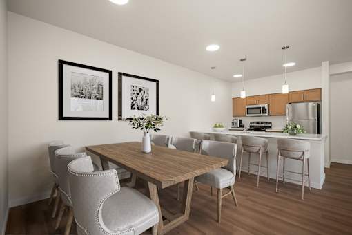 A dining room with a wooden table and grey chairs.