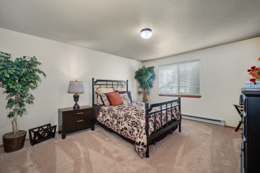 a bedroom with a bed and a window