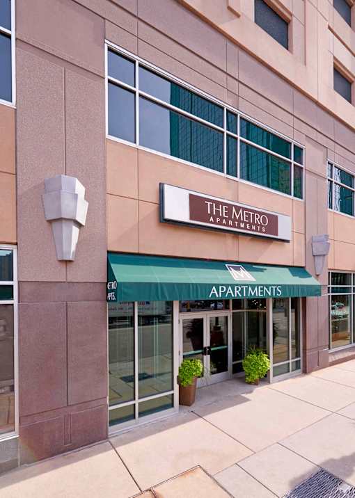 The Metro Apartments building has a green awning.