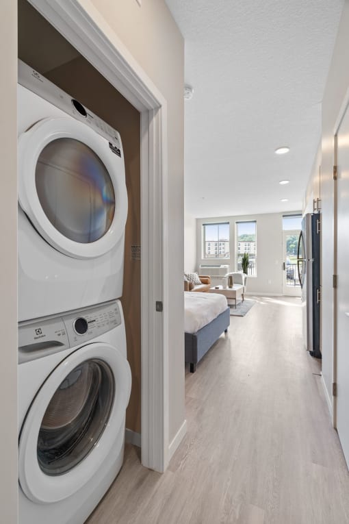 a washer and dryer in a bedroom