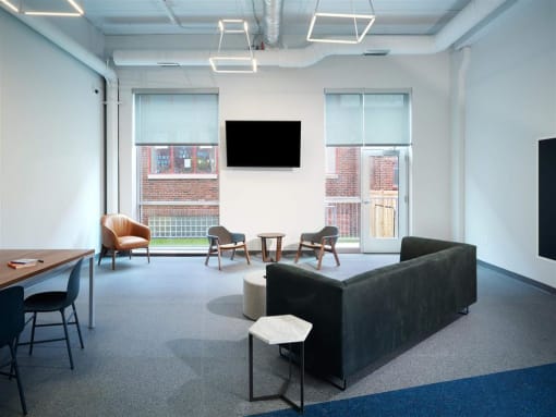a room filled with furniture and a flat screen tv