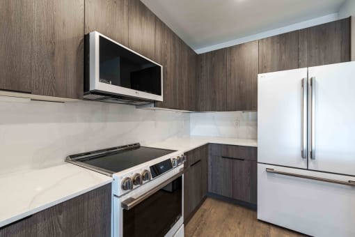 a kitchen with a stove microwave and refrigerator