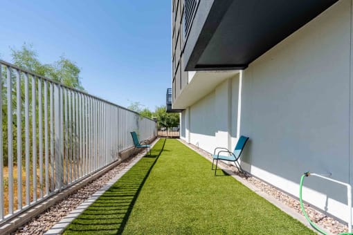our apartments have a private patio with chairs and a dog park