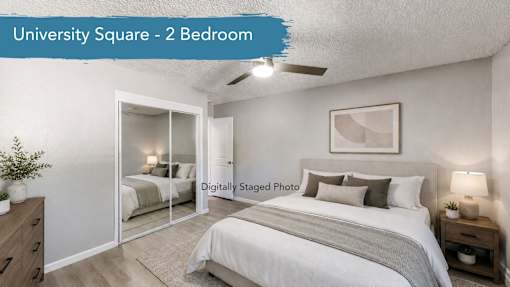 A well-lit, spacious bedroom with a double bed and a mirrored closet door.