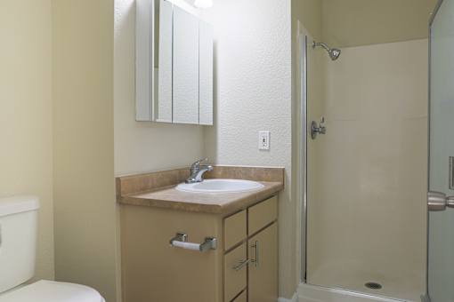 a small bathroom with a sink and a shower at Creekview Homes, Chico, CA, 95928