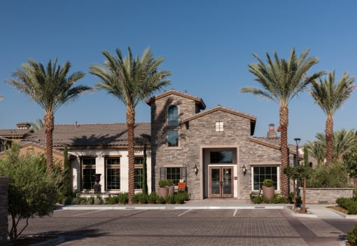 a building with palm trees in front of it