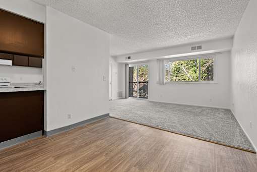 A room with wooden floors and white walls.