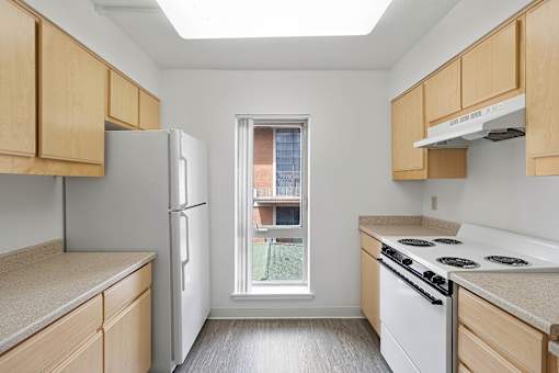 A kitchen with a window overlooking a balcony at Pin Yuen, Sacramento