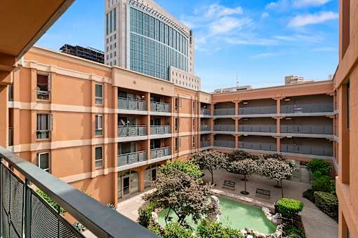 A courtyard with a pool surrounded by buildings at Pin Yuen, Sacramento, CA