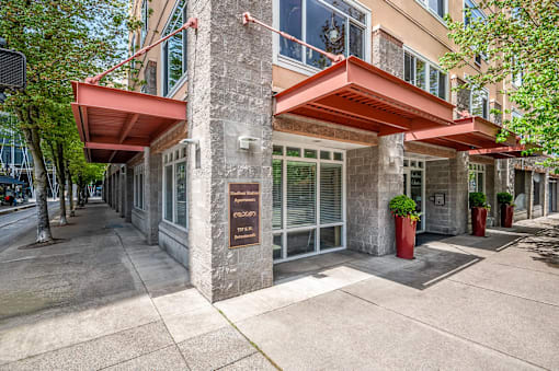 A building with a red awning and a sign on the front.