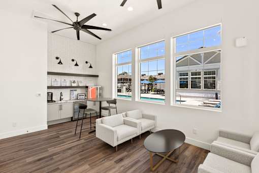 an open living room with a kitchen and a large window at Zora Encanto, Arizona