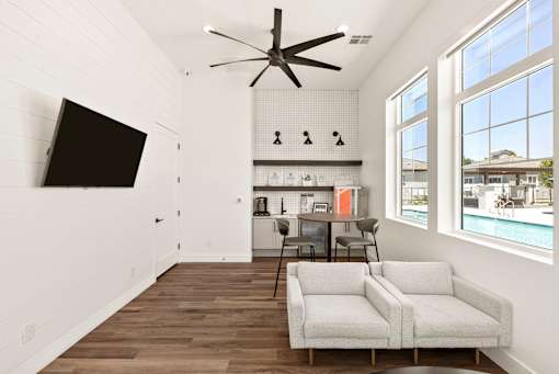 a living room with two couches and a table and a ceiling fan at Zora Encanto, Phoenix, AZ