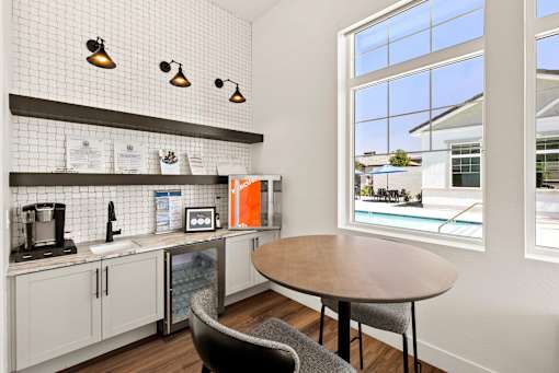 a kitchen and dining area with a large window and a table at Zora Encanto, Phoenix