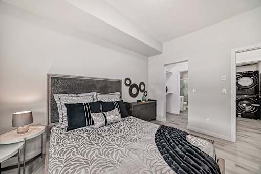 a bedroom with a bed and a closet
