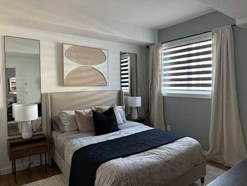 Bedroom With Expansive Window at The Pointe at Riverview, Alberta