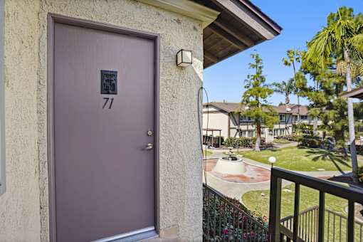A purple door with the number 71 on it.