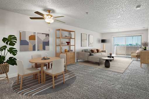 A living room with a dining table and chairs.
