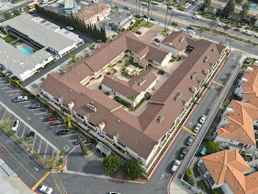 A large building with a parking lot in front of it.