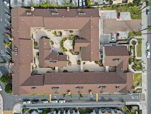 An aerial view of a residential complex with multiple buildings and roads.