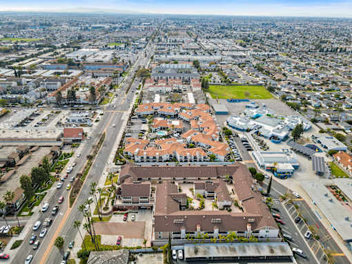 A bird's eye view of a city with a large building in the center.