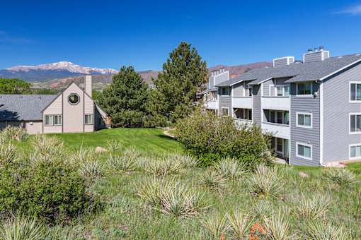 A house with a mountain in the background.