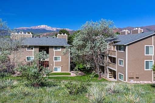 A building with a mountain in the background.