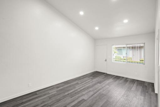 A room with a grey floor and white walls.
