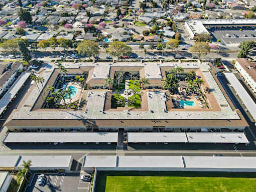 A large building with a pool in the middle of it.