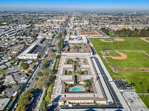 A large building with a pool in the middle of it.
