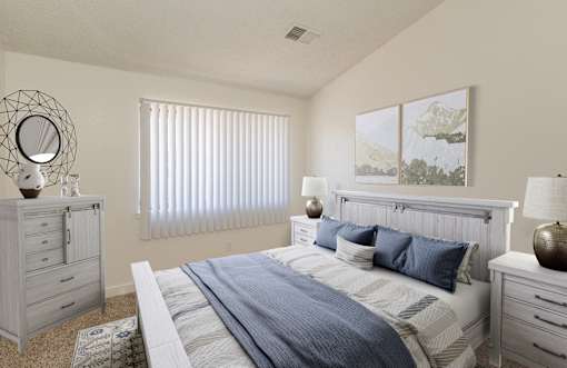 A bedroom with a large bed and a dresser.