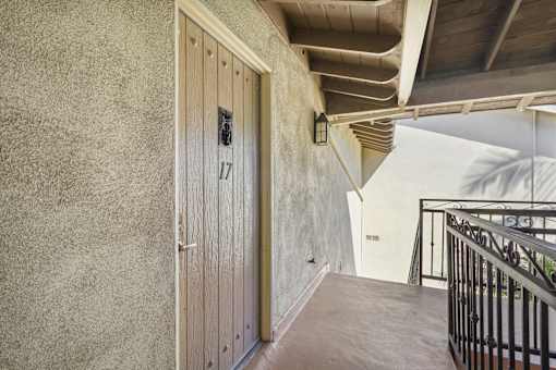 A hallway with a door numbered 17.
