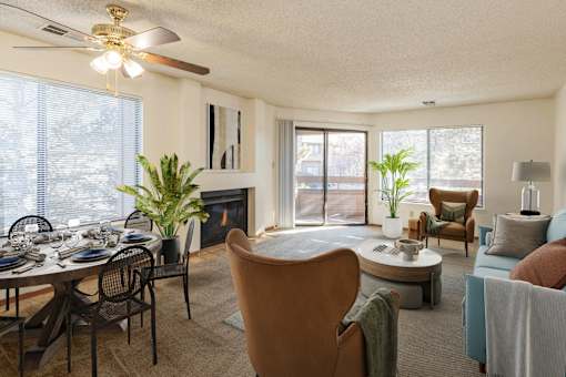 A living room with a dining table and chairs.