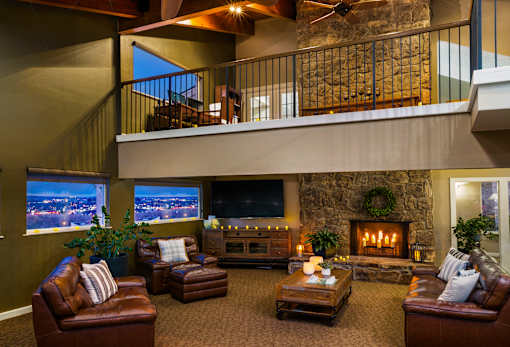 A cozy living room with a fireplace and comfortable seating.