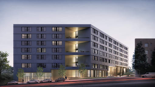 A modern building with a lot of windows is shown in the image.