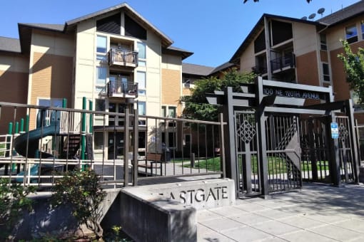 a sign in front of an apartment complex