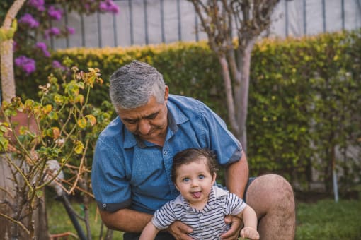 a man holding a baby in his lap