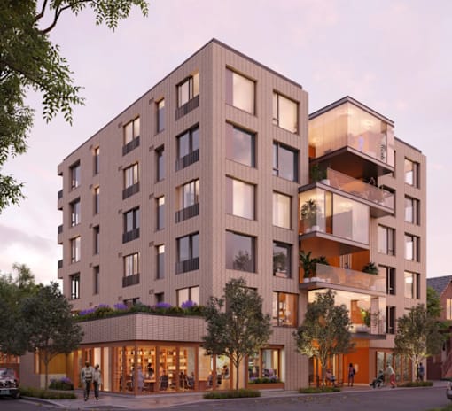 A modern apartment building with balconies and a lobby area.