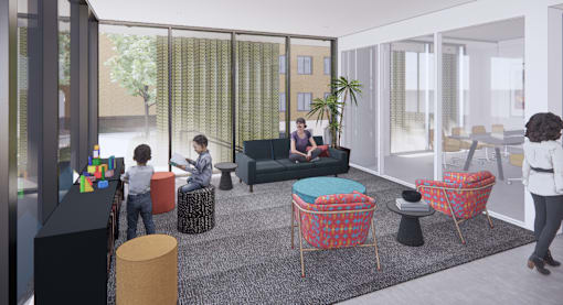 A group of people are sitting in a room with a glass wall and a couch.