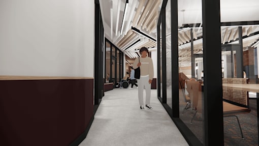 A person is standing in a hallway with a red wall on the left side.