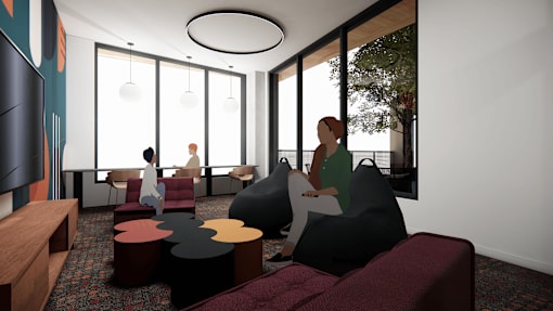 A modern living room with a person sitting on a bean bag chair.