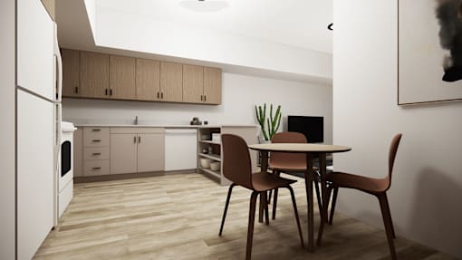 A kitchen with a table and chairs.