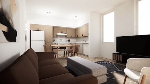 A modern living room with a brown sofa and a television.