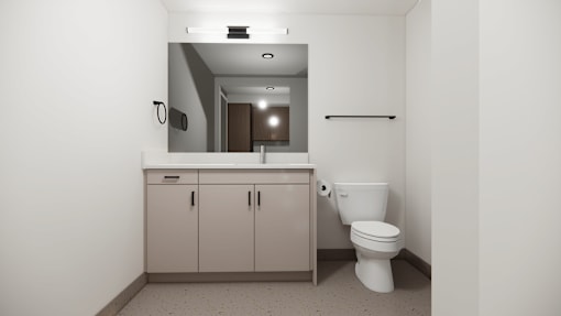 A bathroom with a toilet, sink, and medicine cabinet.