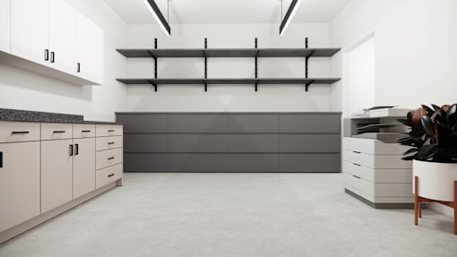 A modern kitchen with white cabinets and a grey countertop.
